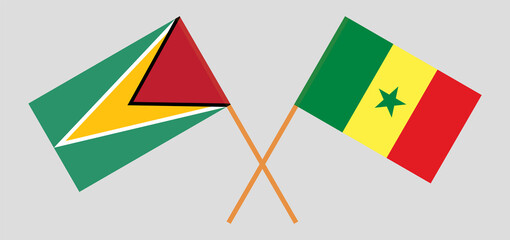 Crossed flags of Guyana and Senegal. Official colors. Correct proportion