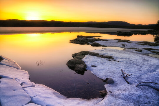 Sheets of ice and snow by Lake Vaeleren on a warm April evening