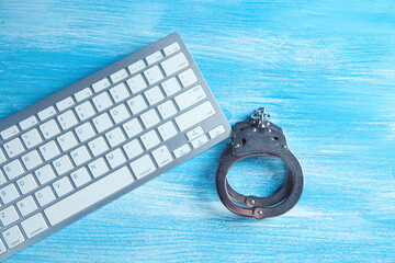 handcuff with laptop on the table