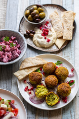 Middle eastern spread with falafel, olives and beetroot salad