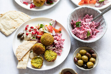 Middle eastern spread with falafel, olives and beetroot salad