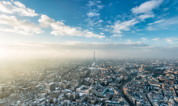 Paris skyline in winter with view of Eiffel Tower at sunset