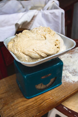 Kneaded bread dough on a old scale