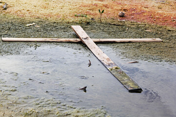 wooden cross on beach
