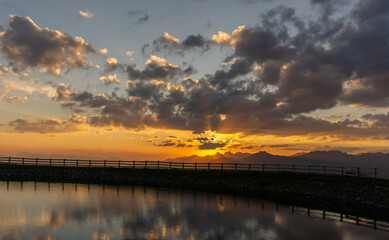 Sun rise in the beautiful tyrolean alps. In the foreground a beautiful mountain lake.