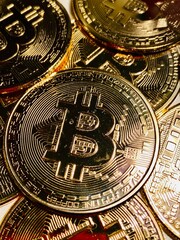 Fototapeta na wymiar Golden bitcoin background, bitcoin is most popular crypto currency with copy space
