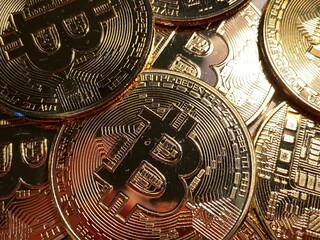 Golden bitcoin background, bitcoin is most popular crypto currency with copy space