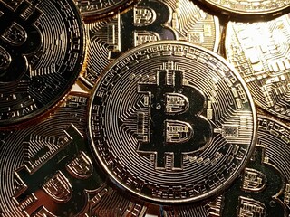 Golden bitcoin background, bitcoin is most popular crypto currency with copy space