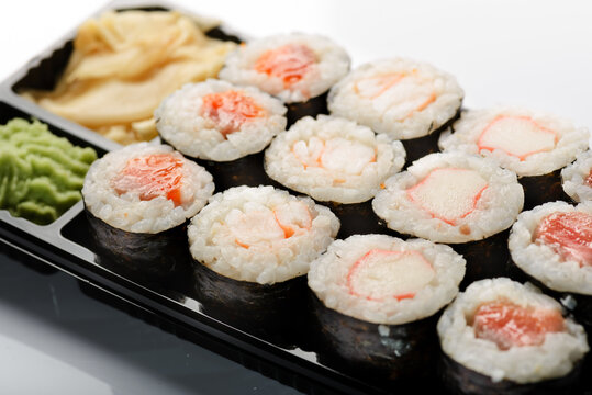 Four sushis on a white background.