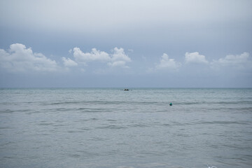 rowers trained in the sea on a cloudy day