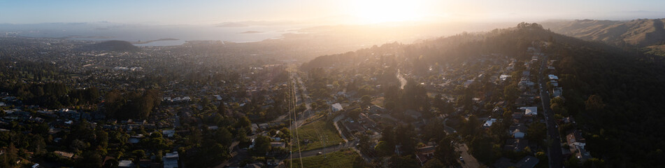 The sun sets over San Francisco Bay and the heavily populated East Bay. The Bay Area is a beautiful...