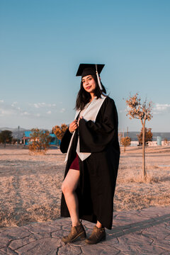 
GIRL WITH BLACK TOGA AND WHITE STOLE
