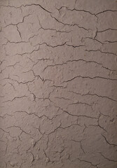 Vertical panoramic view of cracked brown soil