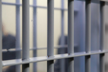 modern prison bars. Symbolic illustrative background for crime news