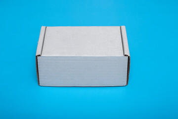 cardboard white box isolated on blue background. layout.mock-up