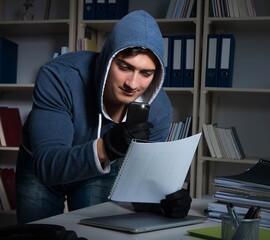 Young man in industrial espionage concept