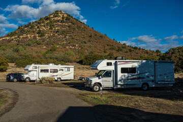 C-type camper with slideouts standing in a wilderness campground in the mountains of the Mesa Verde National Park