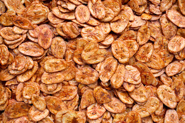 Close up of banana chips. Food background.