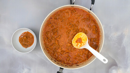 Traditional Hungarian paprikash, or chicken meat with paprika and sour cream sauce recipe. Woman serving meal