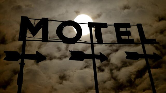 Old Motel Sign By Night with Dark Atmosphere, Fog, Smoke, and Full Moon