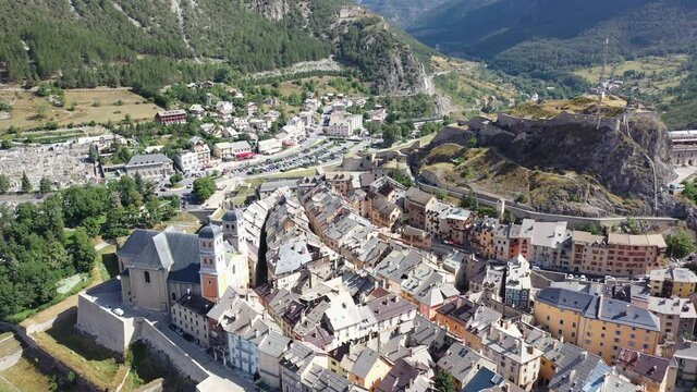 Picturesque autumn landscape with imposing medieval citadel on hilltop on background with French fortified township of Briancon. High quality 4k footage