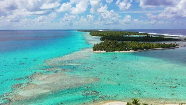 Drone Aerial Video Of Rangiroa Coral Reef Atoll Island Motu In French Polynesia, Tahiti. Amazing Nature Landscape With Blue Lagoon And Pacific Ocean. Tropical Travel Paradise In Tuamotus Islands