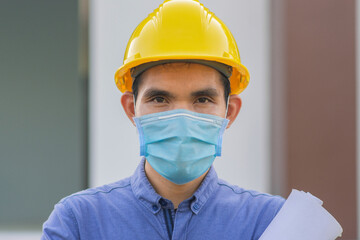 Fototapeta na wymiar Worker wear face mask working in construction site , Man wear mask protect coronavirus covid19