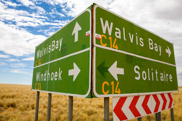 Windhoek and solitaire direction road signs in Namibia with cloudy sky. Namibia 2010