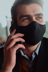 business man wearing protective face mask at office