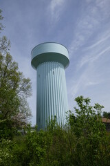 Large water storage tower with blue sky