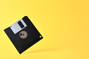 Floppy disk on yellow background