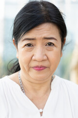sad unhappy asian old senior woman negative facial expression with worry and problem in life