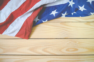 Close up of waving national usa american flag on wooden blackground.