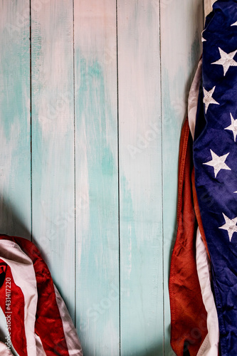 Close up of waving national usa american flag on wooden background.