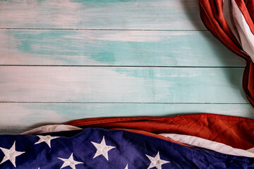 Close up of waving national usa american flag on wooden background.