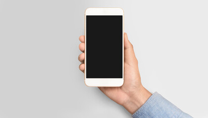 Hand holding smartphone device touching screen