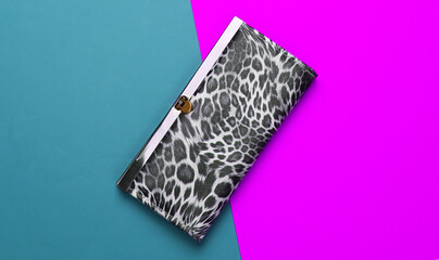 Stylish wallet on colored background. Fashion minimalism. Top view