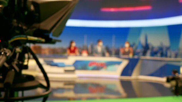 abstract blurred of broadcast camera in studio at TV station.