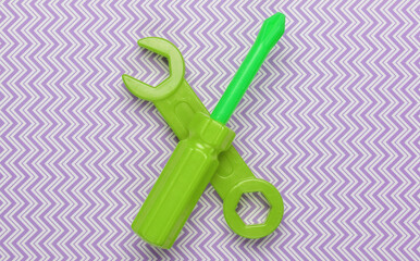 Children's toy tool. Wrench, screwdriver on pastel background. Top view