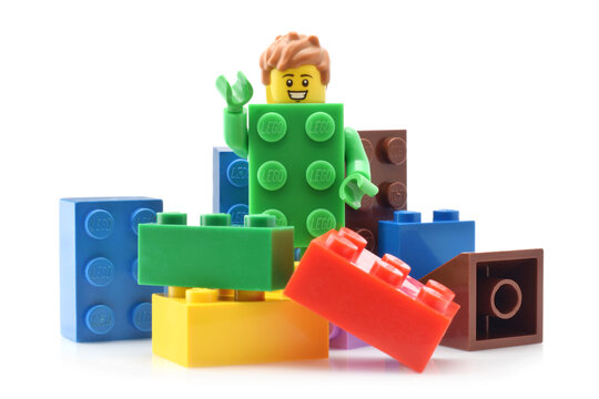 Lego green minifigure toy serie 20 with hands, face, air, legs isolated on white. Editorial illustrative image.
