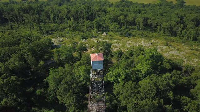 Aerial shot spinning around and looking down on Knob Lick Tower