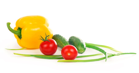 cucumbers, peppers, tomatoes and green onions isolated on white background