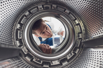 Repairman checking the washing machine