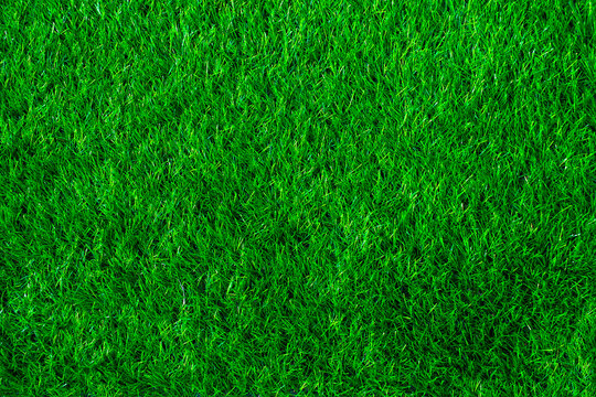Close up green artificial grass for the background