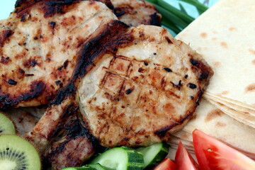 Fresh fried steak with vegetables lies on a plate