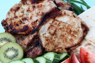 Fresh fried steak with vegetables lies on a plate