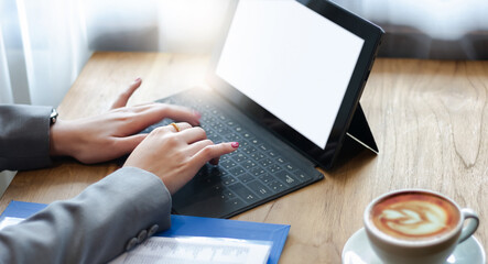 Focus on hand asian businesswoman typing on laptop keyboard while she working or meeting online