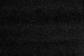 Chaotic white bokeh on a black background. light spots texture. abstraction. falling snow. starry sky. bright glare of light texture