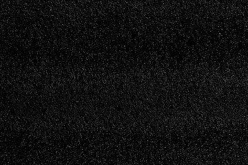 Chaotic white bokeh on a black background. light spots texture. abstraction. falling snow. starry sky. bright glare of light texture