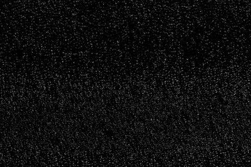 Chaotic white bokeh on a black background. light spots texture. abstraction. falling snow. starry sky. bright glare of light texture